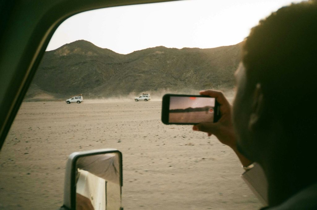 Four-wheel-drive vehicles crossing the Eastern Desert mountains