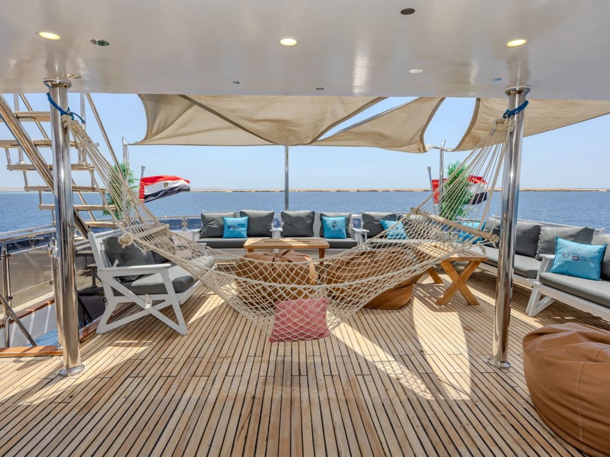 Shaded outdoor seating on the liveaboard sun deck